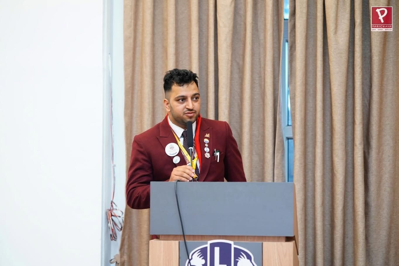 A Leo addressing the room